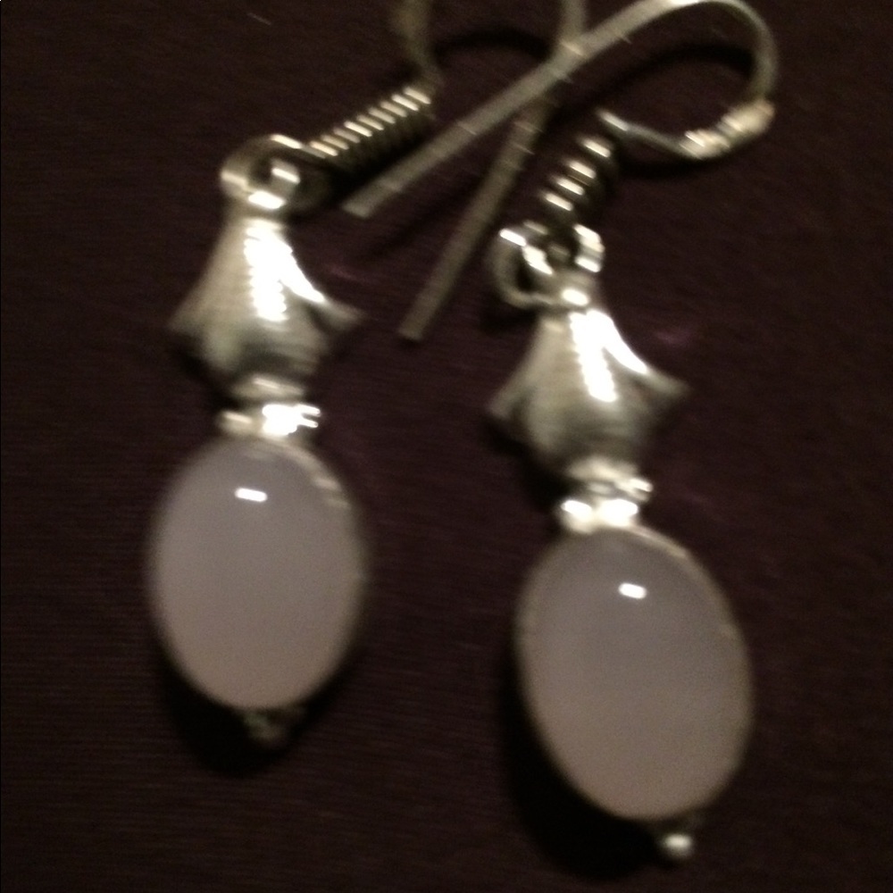 A pair of very light pair of earrings